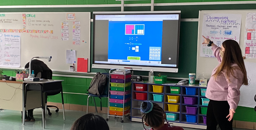 Syracuse Academy of Science and Citizenship fourth grade students use their creative thinking skills to find the solution to their math problem using fractions.