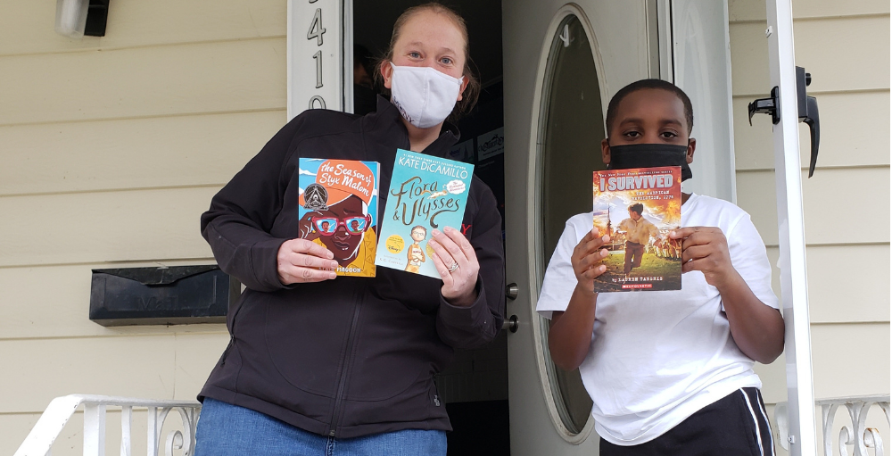 Mrs. Hebbert and Ms. Reed delivered children’s novels to their students during their home visits.