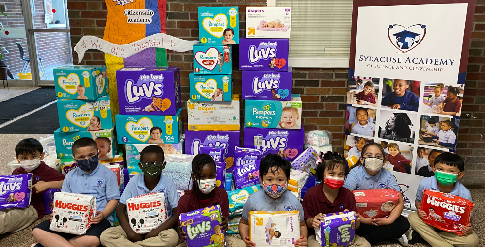 Syracuse Academy of Science and Citizenship elementary school students are giving back to the greater Syracuse community by donating 3,773 diapers to the CNY Diaper Bank.