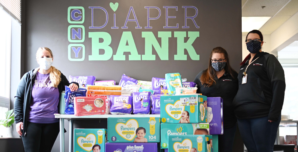 Syracuse Academy of Science and Citizenship elementary school teachers Hayley Merritt and Meghan Ward donated 3,773 diapers that were collected throughout the months of April and May from their students, teachers, faculty and staff, to the CNY Diaper Bank.