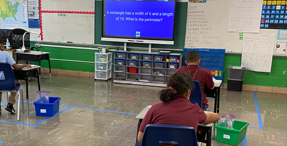 Syracuse Academy of Science and Citizenship students in room 4C played a Jeopardy style review game to prepare for an upcoming math exam.