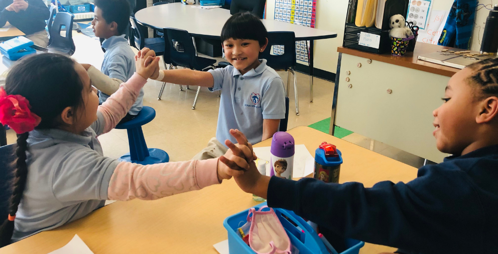 Syracuse Academy of Science and Citizenship elementary school put positivity in action when showing their enthusiasm for their classmates' accomplishments.