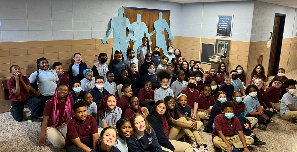 Syracuse Academy of Science and Citizenship elementary school’s 5th-grade students work together on a kindness project that focuses on the Positivity Project’s character traits of friendship and kindness. 