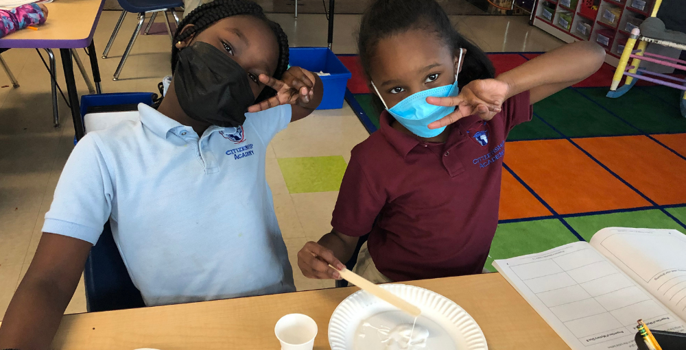 Syracuse Academy of Science and Citizenship elementary school students participate in a STEM activity where they analyze the properties of two mystery glues in efforts to design a ‘new’ glue.  