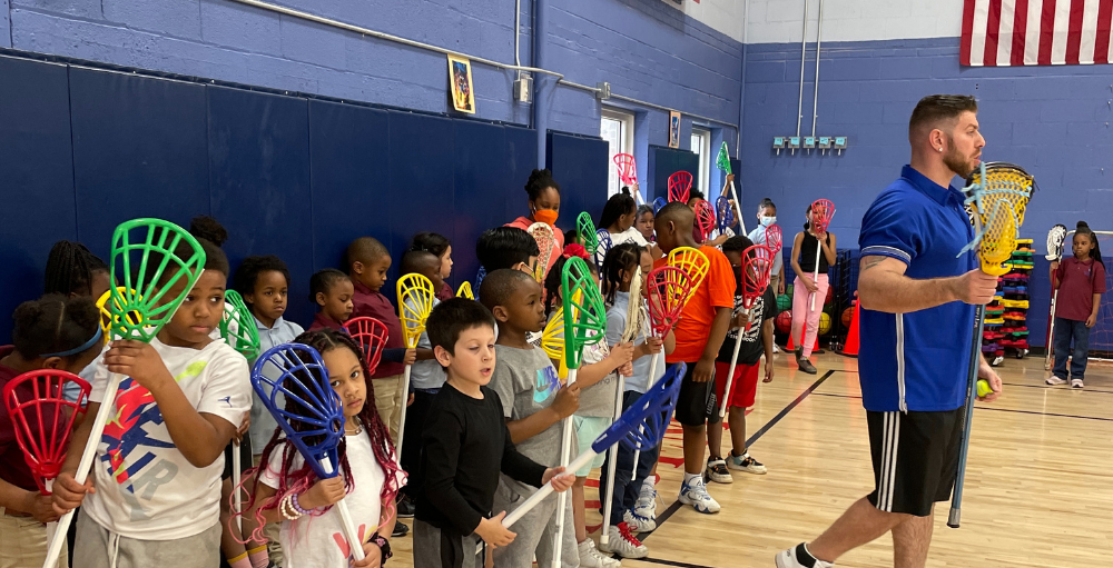  Syracuse Academy of Science and Citizenship elementary school practice and perfect the fundamentals of Lacrosse. Lacrosse is the newest spring sports addition for the Atoms.