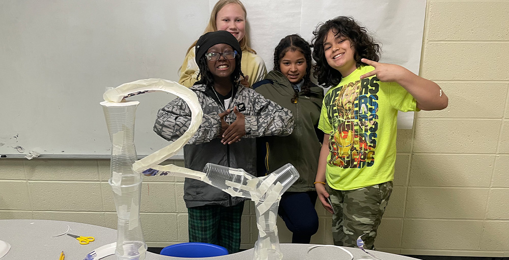 Citizenship & Science Academy of Syracuse Fifth Graders Explore Hands-On Learning Physics Experiment